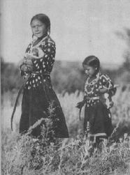 Beautiful Native American Lakota girls collecting firewood on Crying Hill in Mandan, North Dakota.  Resident Patrick Atkinson purchased 5 historically valuable acres on the southeast corner of Crying Hill to stop imminent urban development on the land.